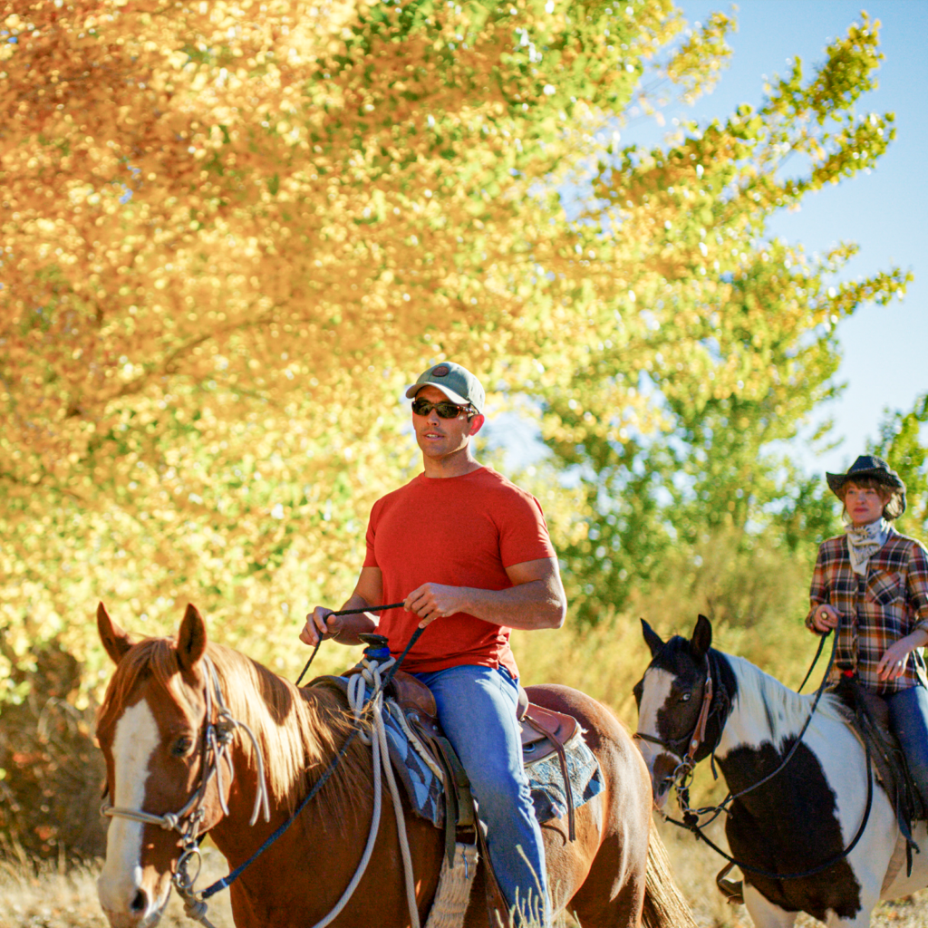 People riding horses on the Santa Ana Pueblo